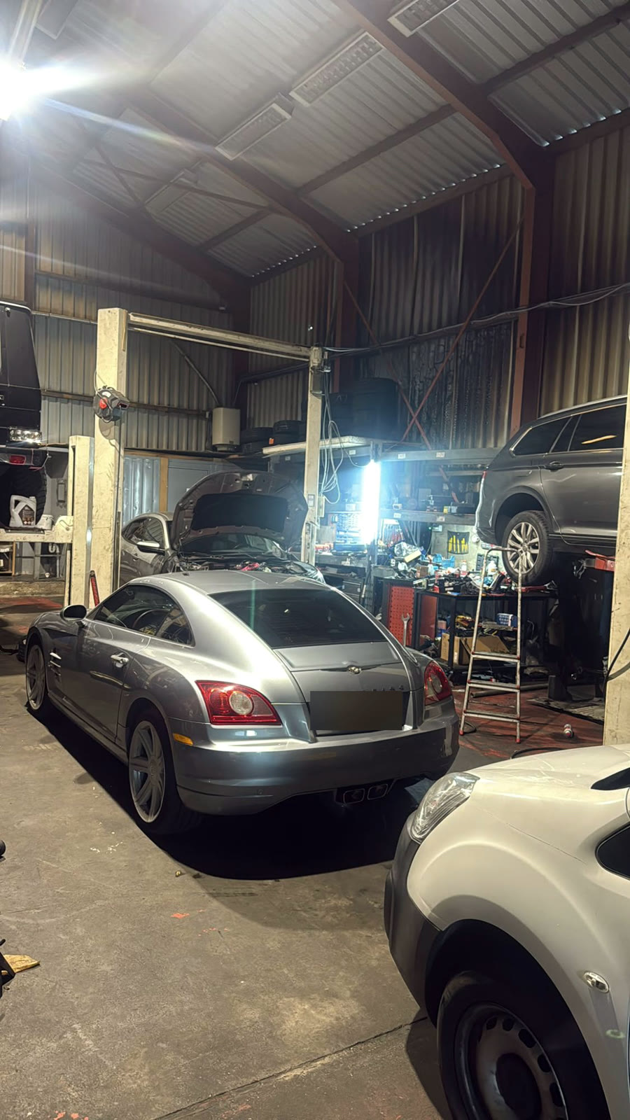 Inside the Senna Auto Service workshop in Vijfhuizen, with cars on the lifts